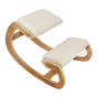Ergonomic kneeling chair with a curved wooden frame and soft cream cushions, designed for comfort and improved posture