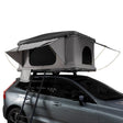 Grey car roof tent mounted on a vehicle, featuring a spacious interior, zippered openings, and sturdy support poles for camping adventures