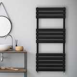 Sleek black flat panel towel radiator mounted on a light gray wall, featuring horizontal slats and modern design elements