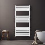 Sleek white flat panel towel radiator mounted on a dark wall, featuring horizontal slats and a modern design, ideal for bathrooms