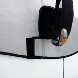 Silver motorhome screen cover with textured surface, fitted snugly around a side mirror, featuring a black Velcro strap for secure attachment