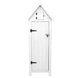 White wooden garden shed with a peaked roof, vertical plank design, black hinges, and a small upper storage compartment