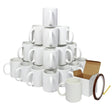Stack of 36 white sublimation mugs arranged in a pyramid with a brown box and heat tape roll beside them, ideal for custom designs