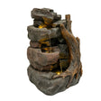 Realistic electric water feature with cascading water, textured stone finish, and illuminated accents, resembling natural rock formations