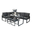 Stylish anthracite grey aluminium corner sofa set with plush cushions, accompanied by a sleek dining table and decorative vase
