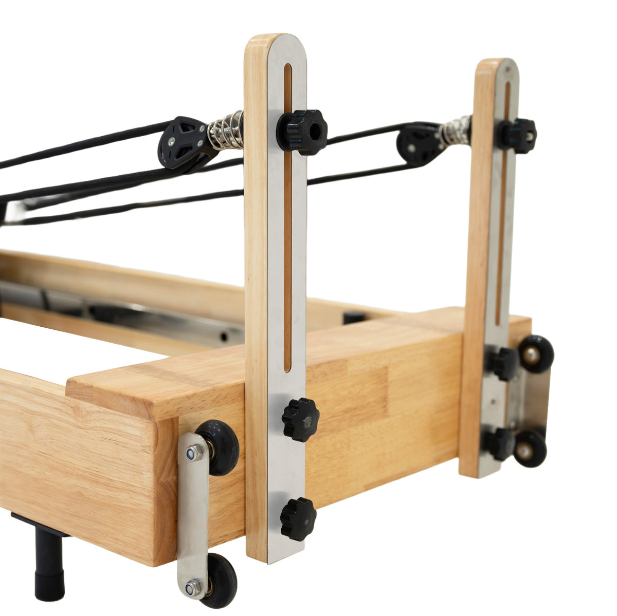 Close-up of a wooden frame with metal tensioners and adjustable knobs, showcasing a sleek, modern design and sturdy construction