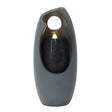 Sleek gray electric water feature with a modern design, featuring a glowing light and textured black stone accents