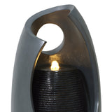Sleek gray electric water feature with a glowing light, featuring textured black stone and a modern, curved design