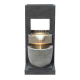 Elegant electric water feature with cascading water, featuring a sleek black stone design and smooth, rounded textures
