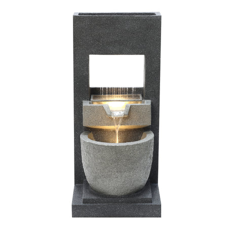 Elegant electric water feature with cascading water, featuring a sleek black stone design and smooth, rounded textures