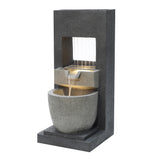 Sleek electric water feature with cascading water, textured dark stone finish, and illuminated basin for a tranquil ambiance