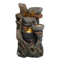 Rustic electric water feature with three stone bowls cascading water over a textured log design, illuminated by soft lighting