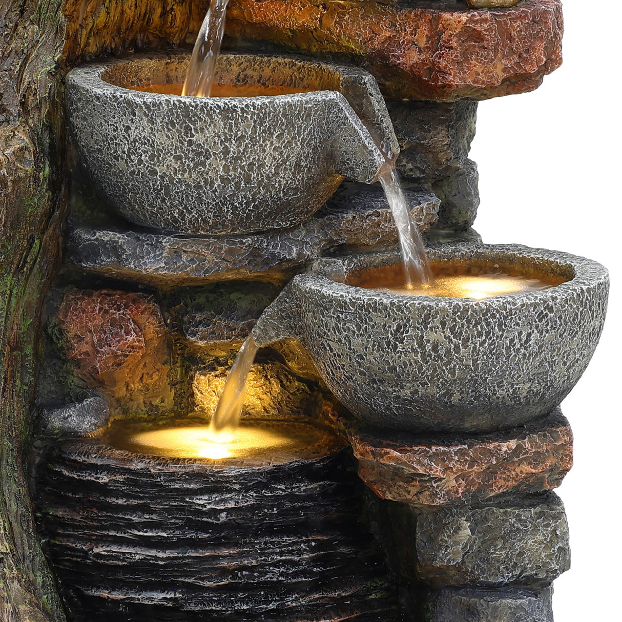 Rustic electric water feature with three textured stone bowls cascading water over layered rock, creating a serene ambiance