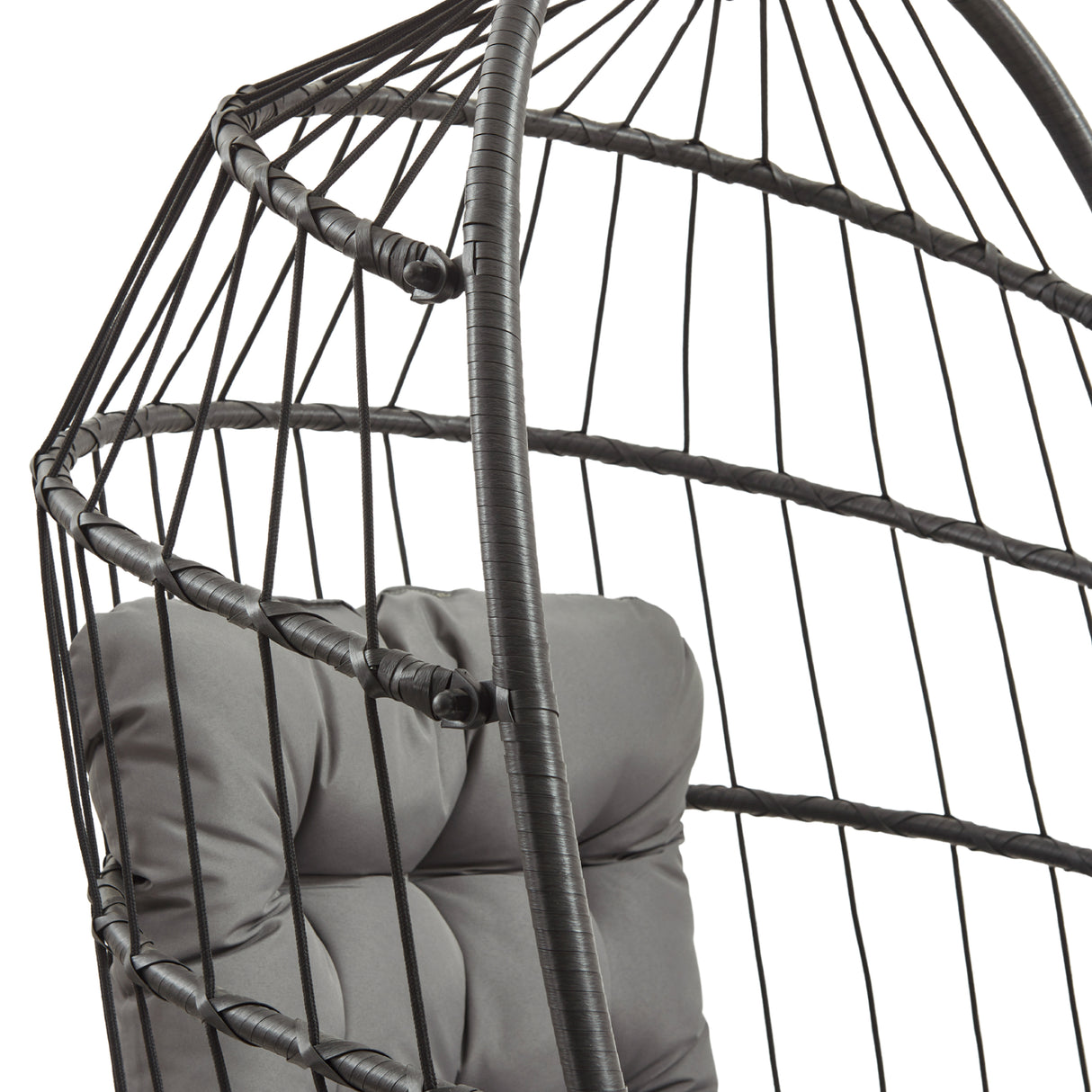 Black rattan hanging egg chair featuring a cushioned seat with tufted gray fabric, showcasing a modern and stylish design
