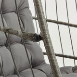 Grey rattan hanging egg chair featuring a cushioned seat, woven texture, and sturdy frame, perfect for indoor or outdoor relaxation