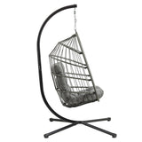 Grey rattan hanging egg chair with plush cushioning, suspended from a sleek black metal frame, perfect for outdoor relaxation