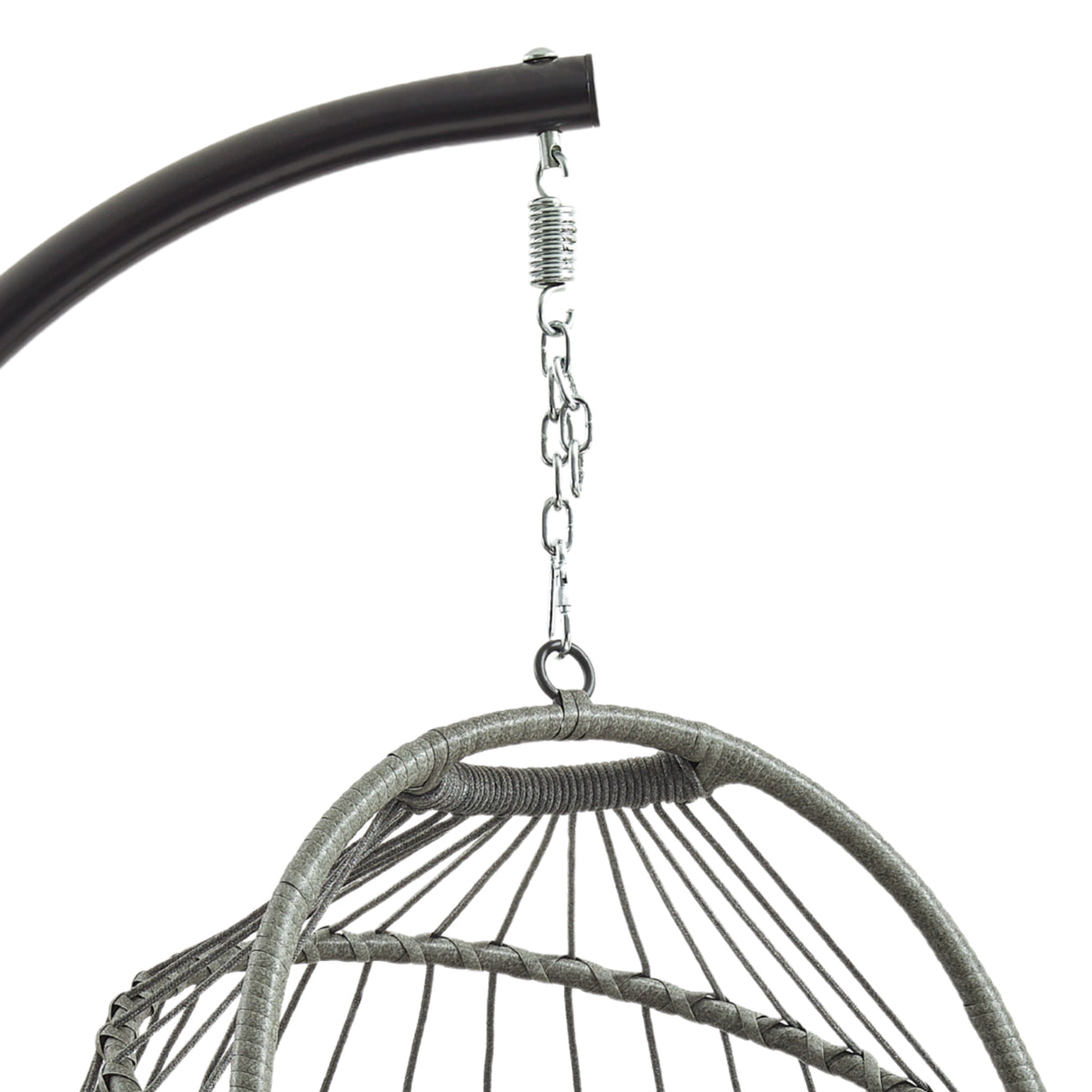 Grey rattan hanging egg chair suspended from a sleek metal frame, featuring a woven texture and curved shape for cozy seating