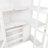 Bright white Victorian greenhouse interior featuring wooden shelves, clean lines, and ample space for plants and gardening supplies