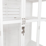 Elegant Victorian greenhouse in white wood, featuring glass panels, sleek metal handles, and a secure lock for plant protection