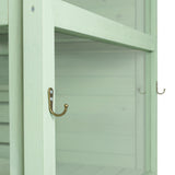Victorian greenhouse in soft green wood, featuring elegant brass hooks and a textured finish, ideal for plant display and storage