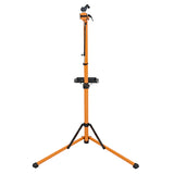 Sturdy orange bike mechanic repair stand with adjustable height, tripod base, and tool tray for efficient bicycle maintenance