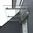 Stylish glass door canopy with sleek stainless steel brackets, measuring 180cm wide and 80cm deep, enhancing outdoor aesthetics