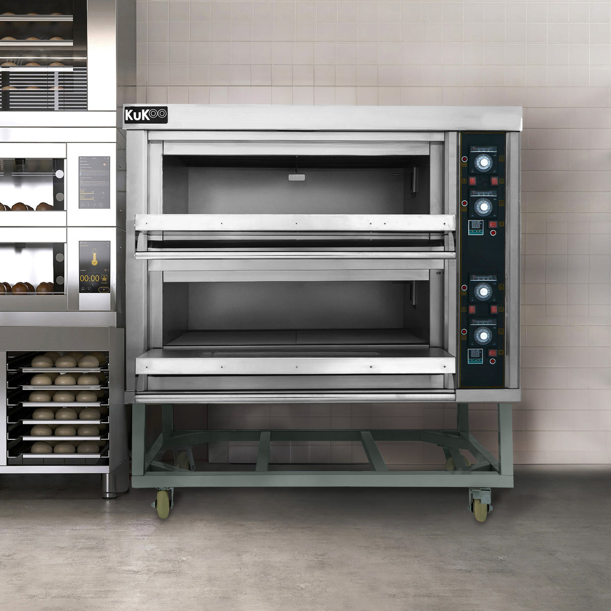 Stainless steel KuKoo large commercial pizza oven with two spacious baking chambers, featuring control knobs and a sturdy wheeled base
