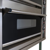 Large commercial pizza oven with stainless steel finish, dual baking chambers, and temperature controls for efficient cooking