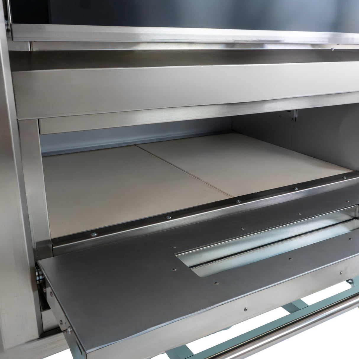 Large commercial pizza oven featuring a stainless steel exterior, spacious baking chamber, and smooth stone baking surface