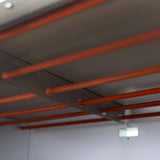 Interior view of the KuKoo large commercial pizza oven showcasing metal racks with orange rods for even heat distribution