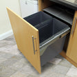 Pull-out 90L recycle waste bin with two gray containers, sleek metal handles, and a wooden cabinet door, ideal for organized waste disposal