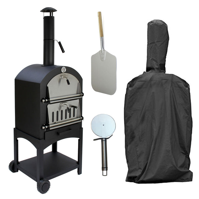 Black KuKoo outdoor pizza oven with stainless steel accents, pizza peel, cutter, and protective cover, ideal for backyard cooking