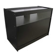 Sleek black retail shop counter with a smooth finish, featuring a glass display top and open shelving for easy access and visibility