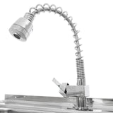 Polished chrome faucet with a flexible, coiled neck and a lever handle, mounted above a stainless steel double bowl sink