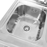 Stainless steel double bowl catering sink with a right-hand drainer, featuring a polished finish and a central drain