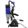 T-Mech magnetic drill press with blue and silver body, adjustable handles, coolant container, and control panel featuring switches
