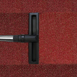 Black nozzle of a 90L Maxblast industrial vacuum on textured red carpet, showcasing its wet and dry cleaning capabilities