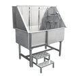 Stainless steel dog grooming bath station with a sloped design, adjustable showerhead, and two-step access for pets