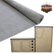 Smoke grey van lining material rolls alongside a camper kitchen unit, featuring smooth surfaces and adhesive bottles for installation