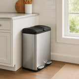 Sleek 60L dual pedal bin in stainless steel with black accents, positioned beside a kitchen cabinet on a wooden floor