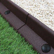 Flexible brown lawn edging measuring 1.2m, featuring a textured surface, smooth edges, and round connectors, ideal for garden borders