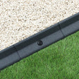 Flexible grey lawn edging, 1.2m long, featuring a smooth texture, curved shape, and contrasting with white gravel and green grass