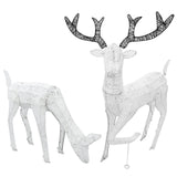 Large light-up stag and doe reindeer set featuring a textured white finish, intricate black antlers, and a festive glow