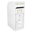 White Royal Mail post box with gold lettering, featuring a slot for mail, collection times displayed, and a classic design
