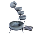 Grey four-tier spilling bowls water feature with a solar panel, featuring smooth textures and a modern design for outdoor decor