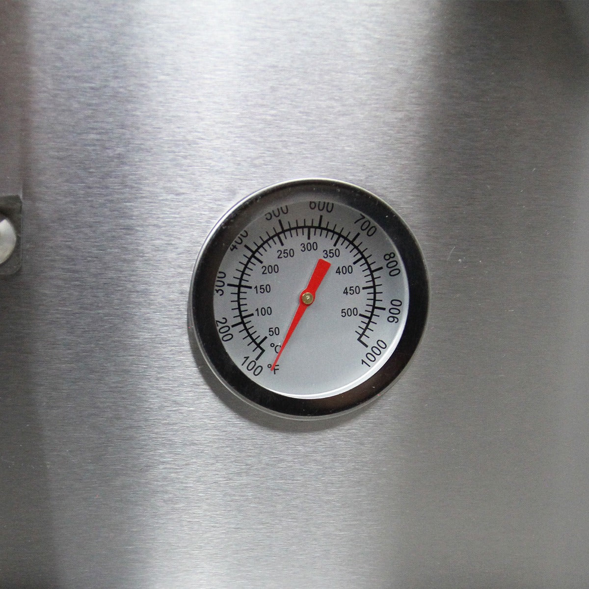 Stainless steel pizza oven thermometer with a red needle, displaying temperature readings from 0 to 1000 degrees Fahrenheit