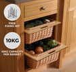 Two pull-out wicker kitchen baskets with a natural finish, holding fresh vegetables, set in a wooden cabinet with a sleek design