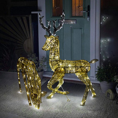 Gold stag and doe set illuminated with warm white lights, featuring intricate wire detailing and a festive design, perfect for holiday decor