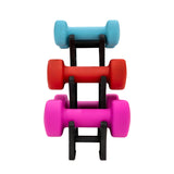 Colorful set of small dumbbells in blue, red, and pink stacked on a black rack, ideal for home workouts and fitness routines