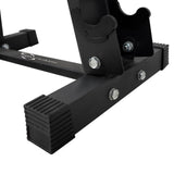 Sturdy black metal base of a fitness equipment stand, featuring rubber feet for stability and silver bolts for secure assembly